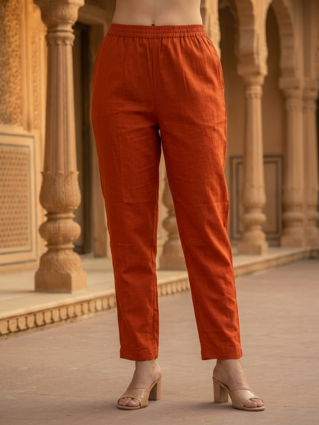 Rust Solid Muslin Silk Straight Kurta Set with Pearl & Threadwork Embroidery, Round Neck, Trouser & Poly Chanderi Self Design Tassel Dupatta