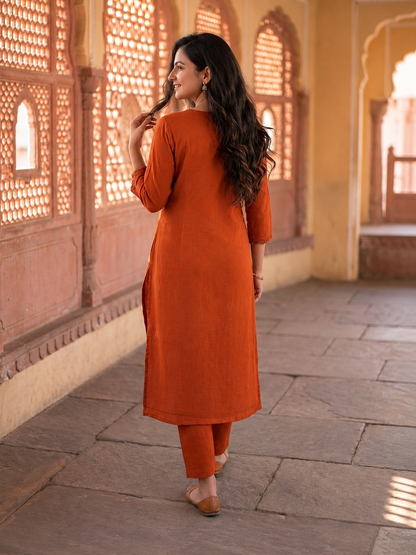 Rust Solid Cotton A-Line Pleated Kurta Set with Mirror & Threadwork Embroidery, V-Neck, Trouser & Pure Cotton Mirror Dupatta