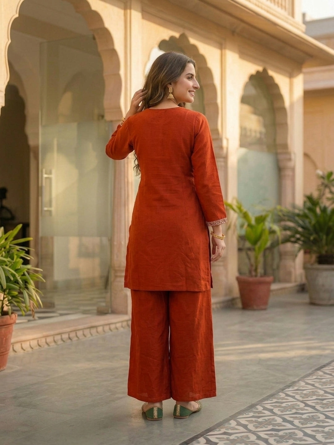 Rust Solid Crepe Straight Kurta Set with Floral Hand Embroidery & Sequin, Flared Palazzo & Taping Dupatta