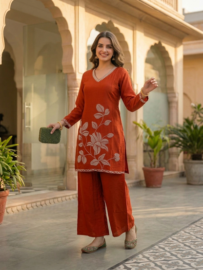 Rust Solid Crepe Straight Kurta Set with Floral Hand Embroidery & Sequin, Flared Palazzo & Taping Dupatta