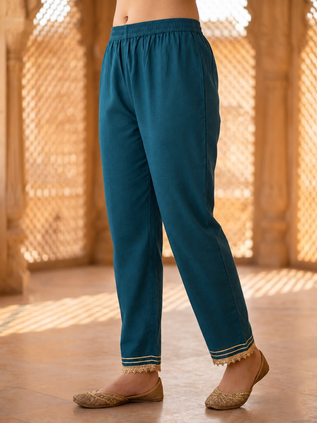 Back view of teal blue A-line kurta and matching trousers