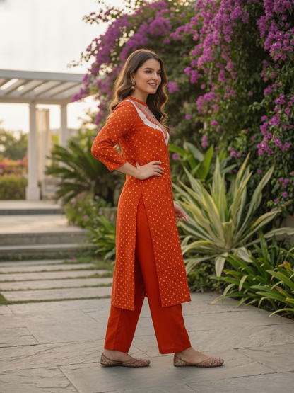Close-up of the printed and embroidered detail on the rust orange kurta