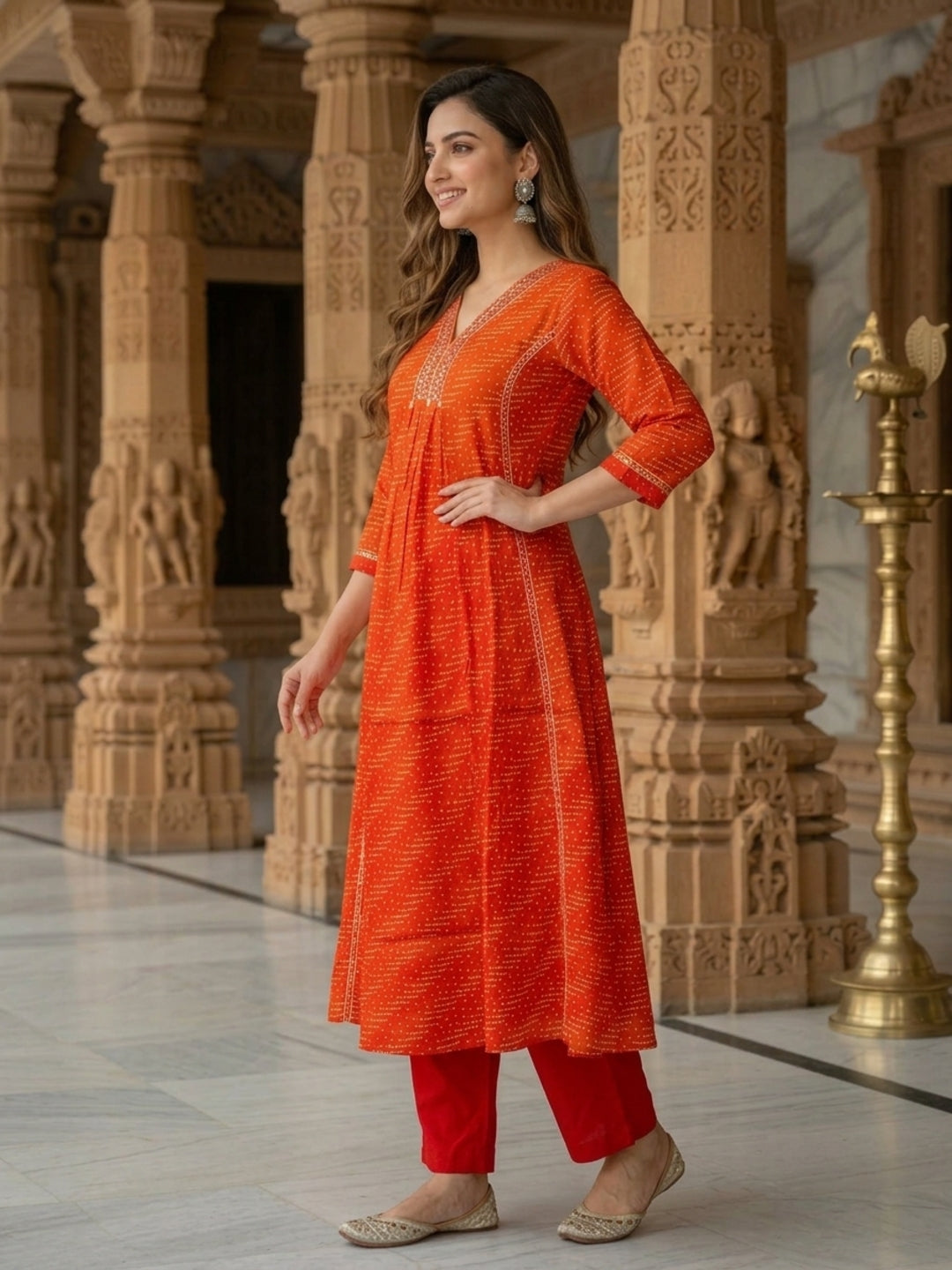 Side view of rust A-line kurta set with matching dupatta