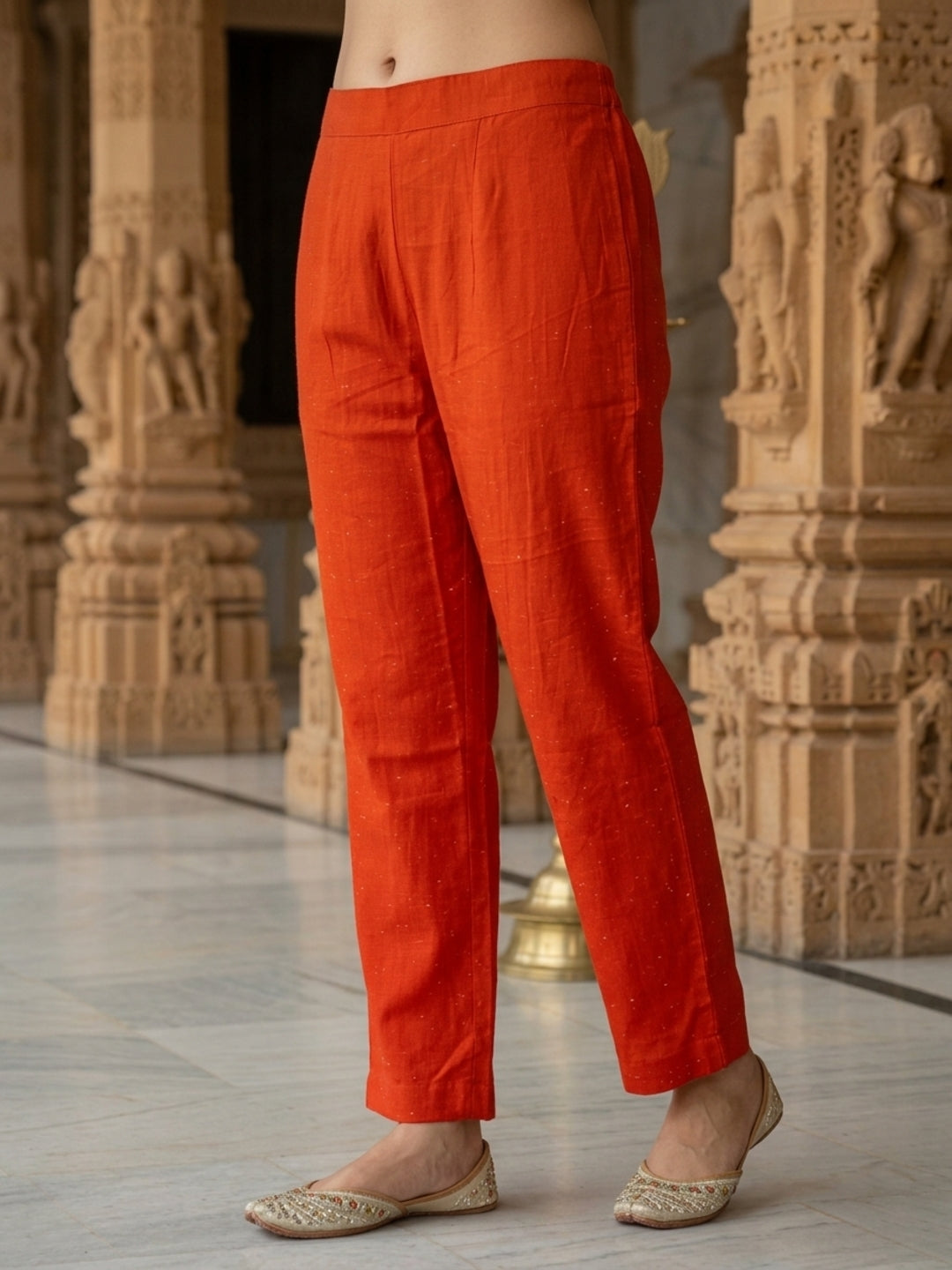 Side profile of rust Bandhani-print kurta with printed dupatta